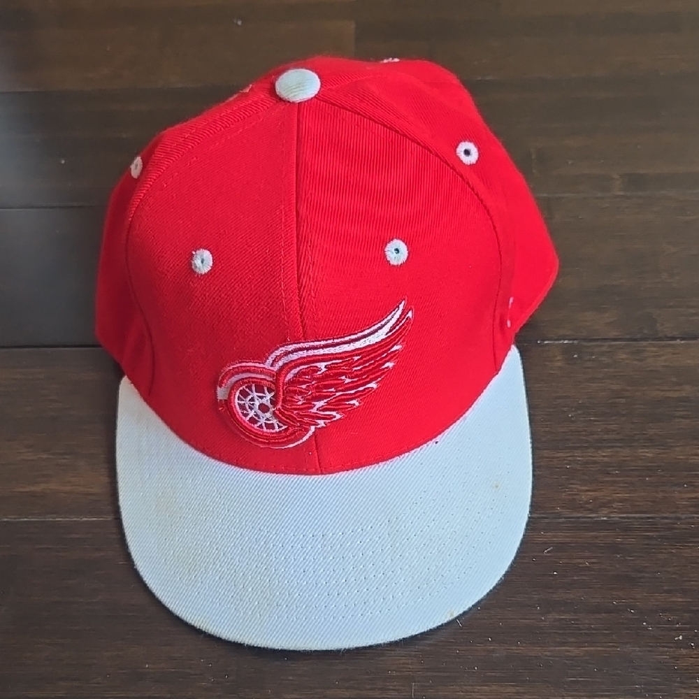 Red and White Cap with Winged Wheel Logo